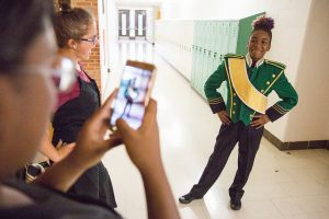 Girl in marching band uniform.