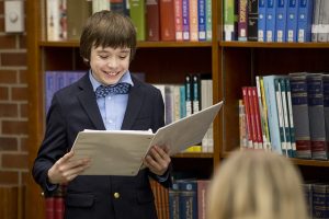 Student holding notes at debate tournament