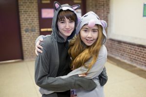 Two students wearing pajamas