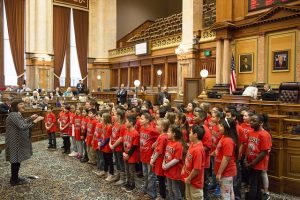 Students singing at state capitol.