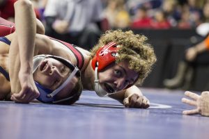 High school wrestler being pinned