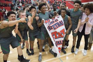 Basketball team celebrating a win.