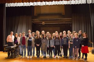 Group of students standing on a stage