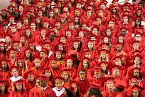 Group of students in red caps and gowns